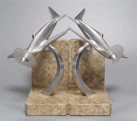 A pair of Art Deco style aluminium low-wing monoplane bookends, 19cm high
